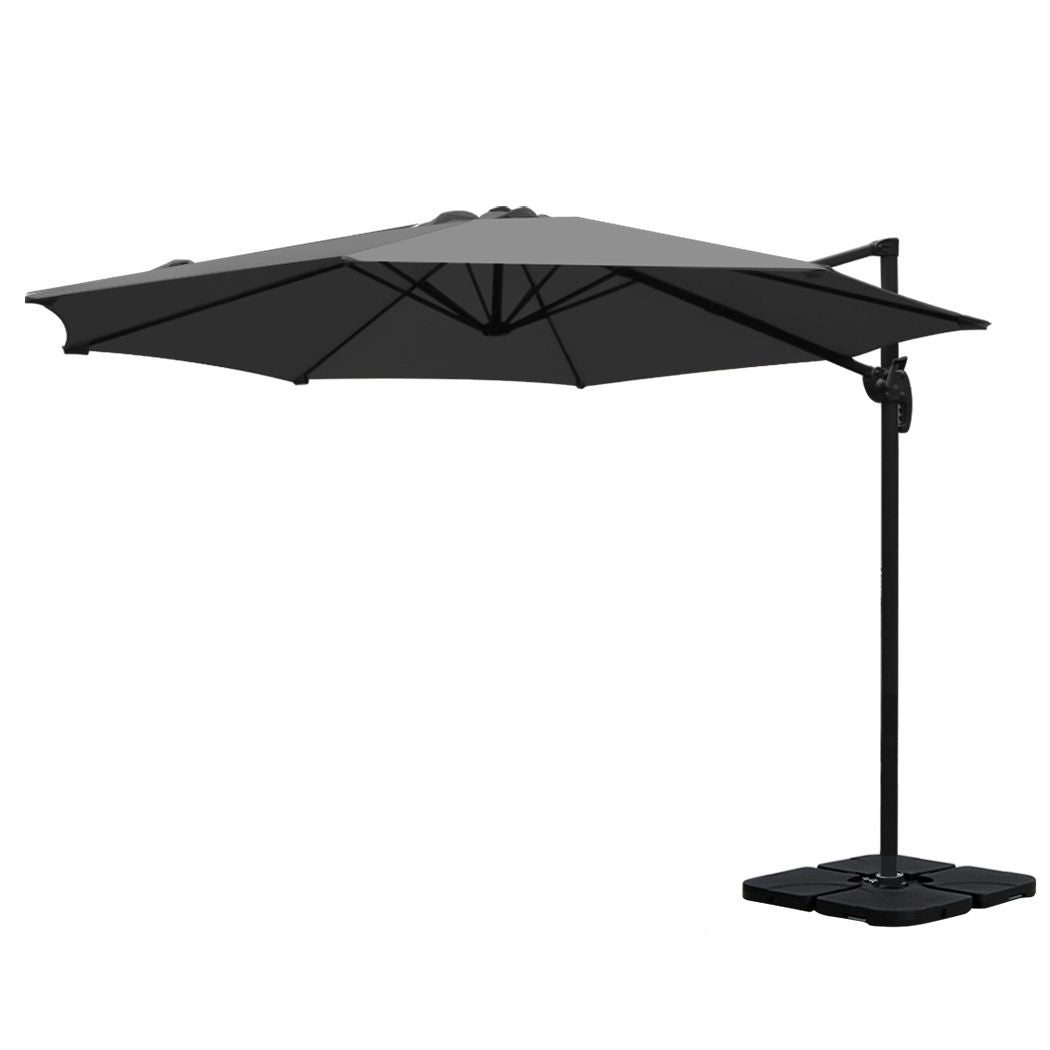 Charcoal cantilever patio umbrella with black crank pole and square weighted base
