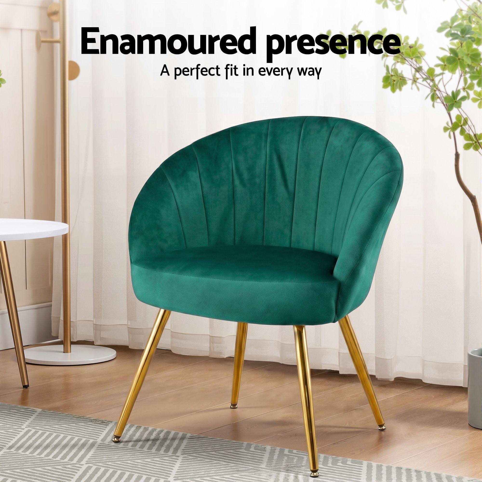 Green velvet armchair with curved back and padded seat, gold tapered legs
