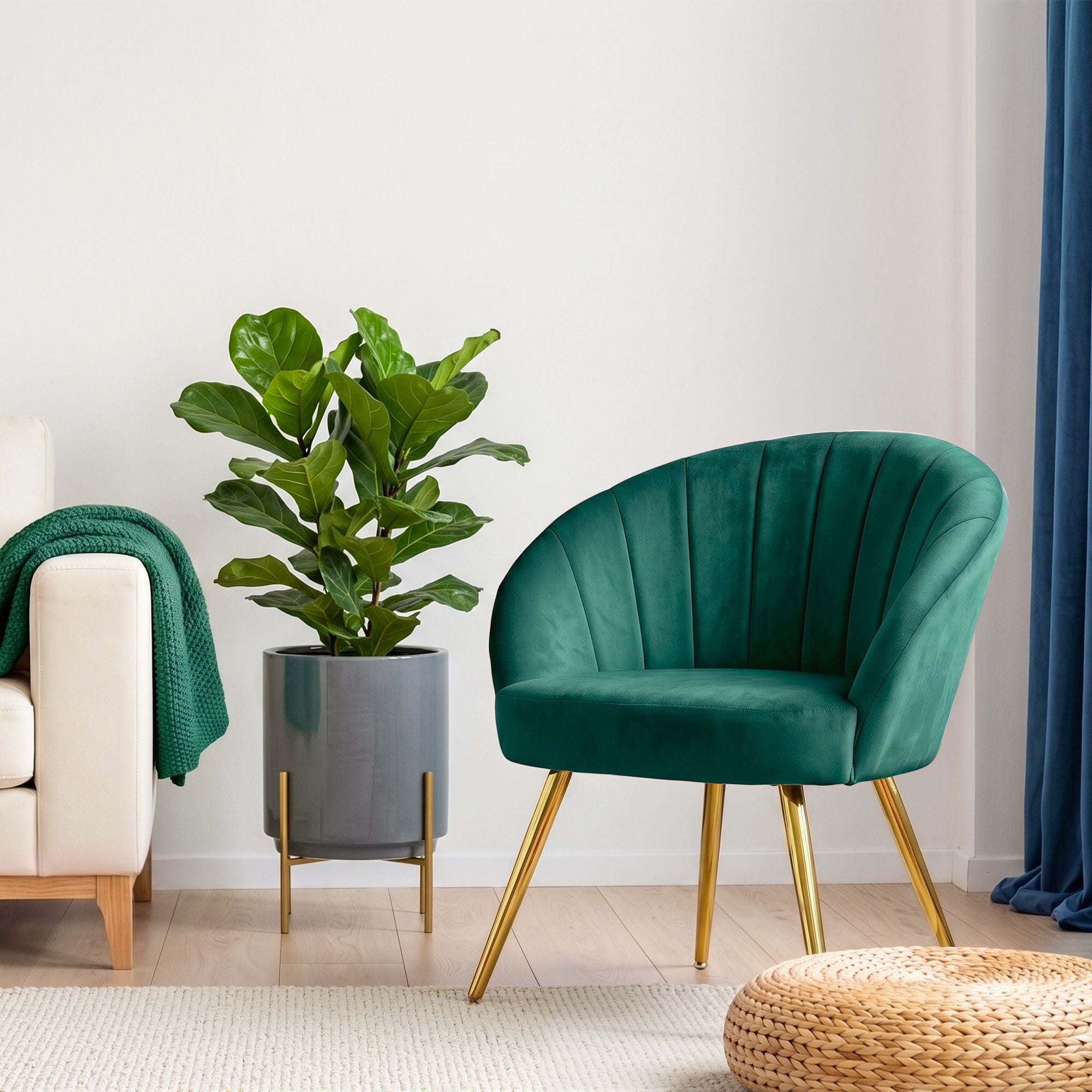 Green velvet armchair with curved back and padded seat, gold tapered legs