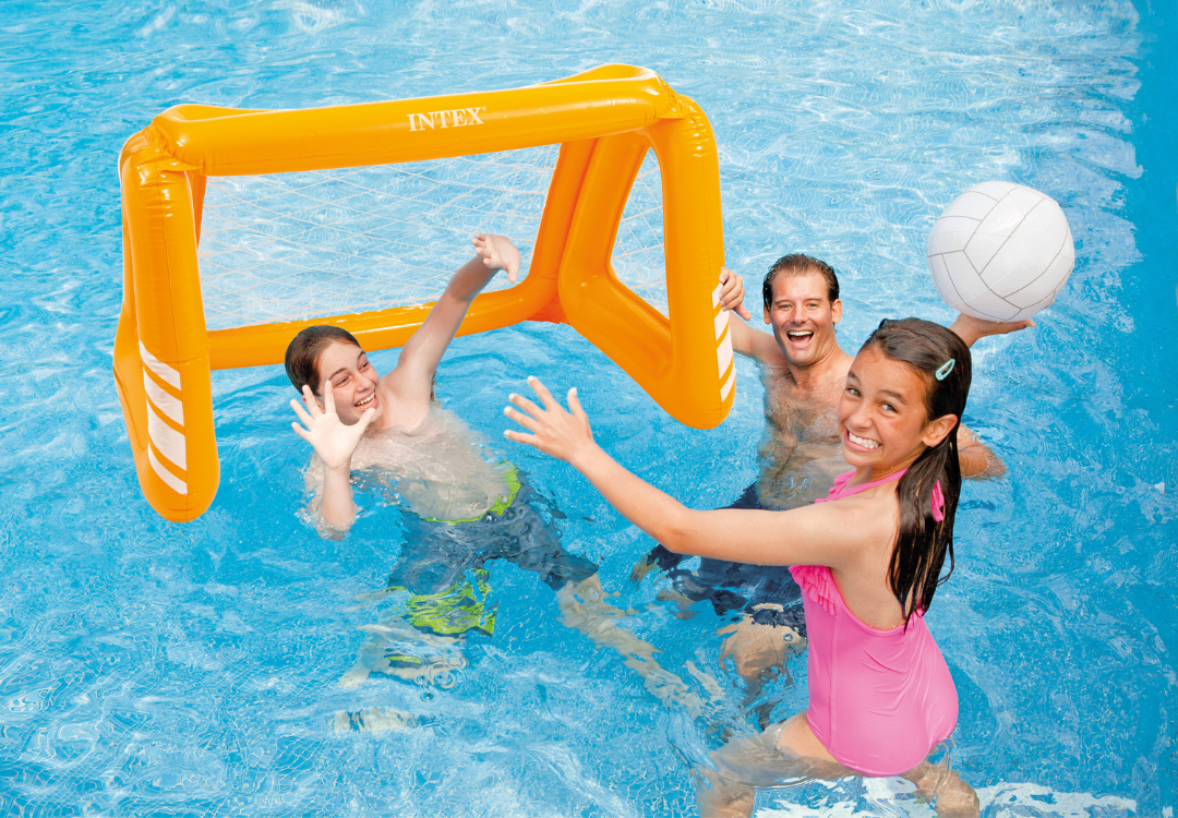 Inflatable orange pool goal with net in water, with volleyball and kids playing.