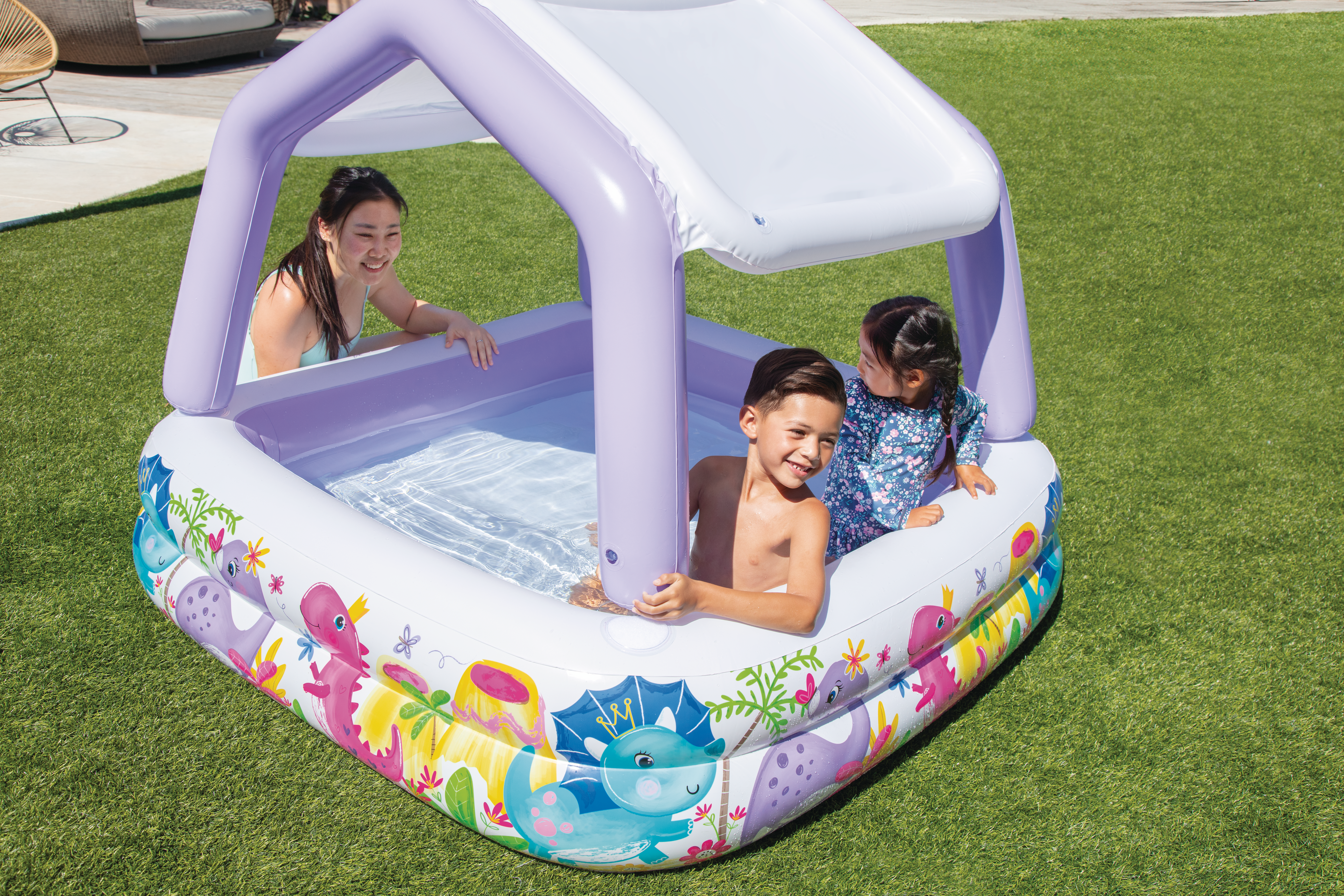 Inflatable kids pool with purple frame sunshade and colorful ocean animal print