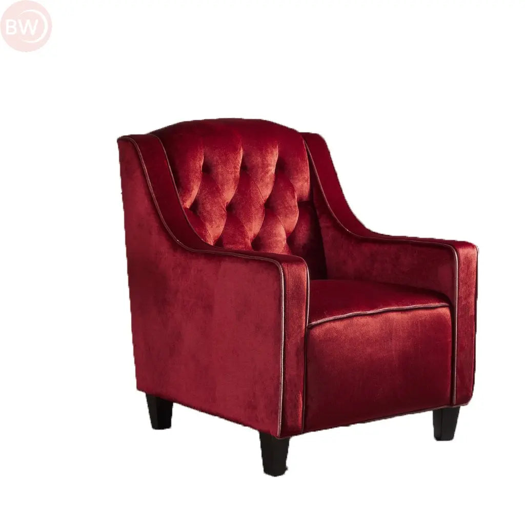 Velvet club armchair with button-tufted back, curved arms, dark legs, rich red