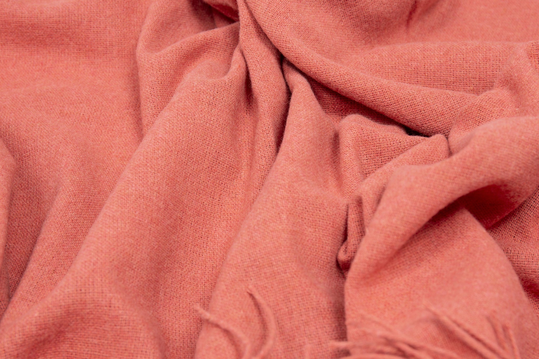 Peach wool-blend throw fabric with soft weave texture