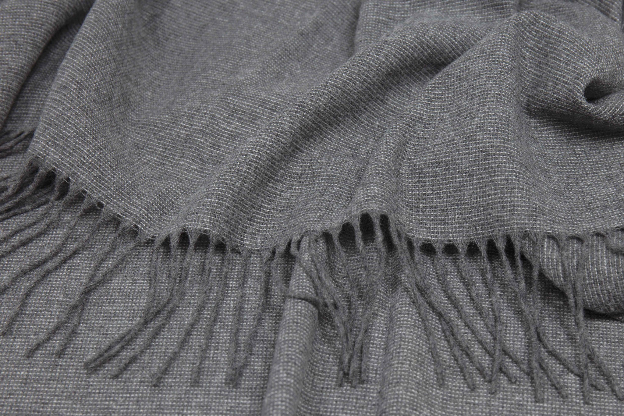 Slate wool-blend throw blanket, close-up of woven texture and fringe border
