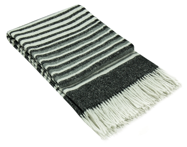 Monochrome striped wool-blend throw with fringed ends, folded corner view.