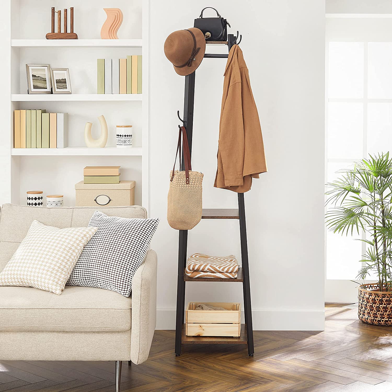 Coat rack with 3 shelves and hanging hooks, displaying bags and outerwear.