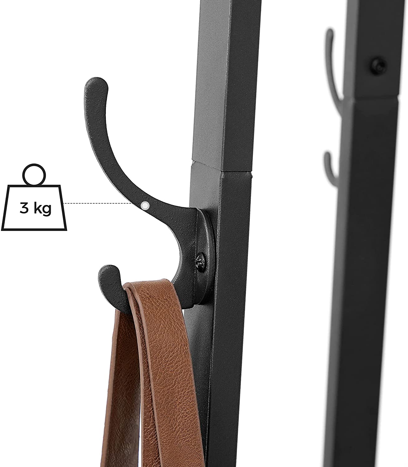 Coat rack hook detail with hanging brown strap and black metal frame.