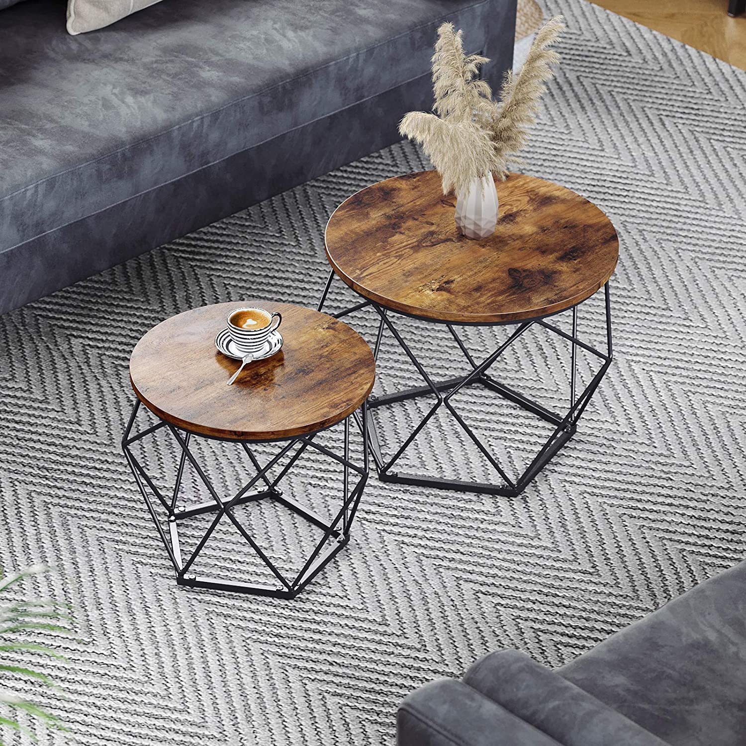 Set of 2 round side tables with rustic brown tops and black steel X-frame legs