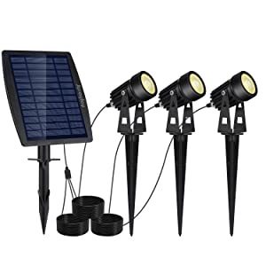 Solar LED spotlight kit with one solar panel and three black lamp heads with stakes