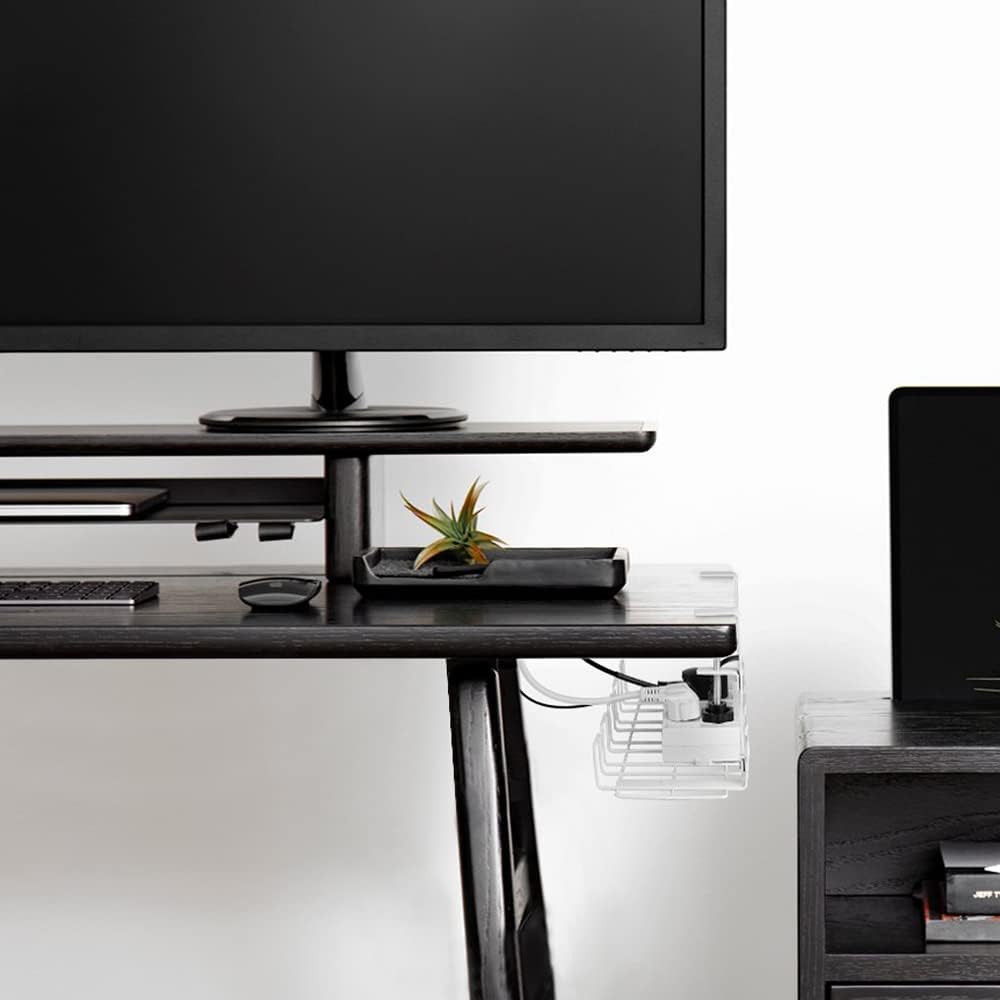 White under-desk cable tray attached beneath a desk with monitor cables secured