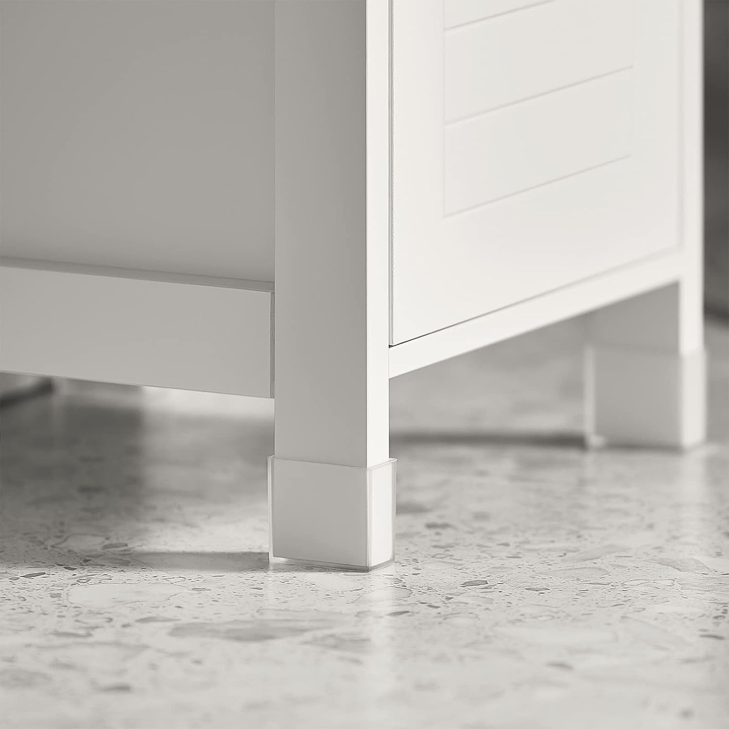 White cabinet base with four legs and lower drawer front