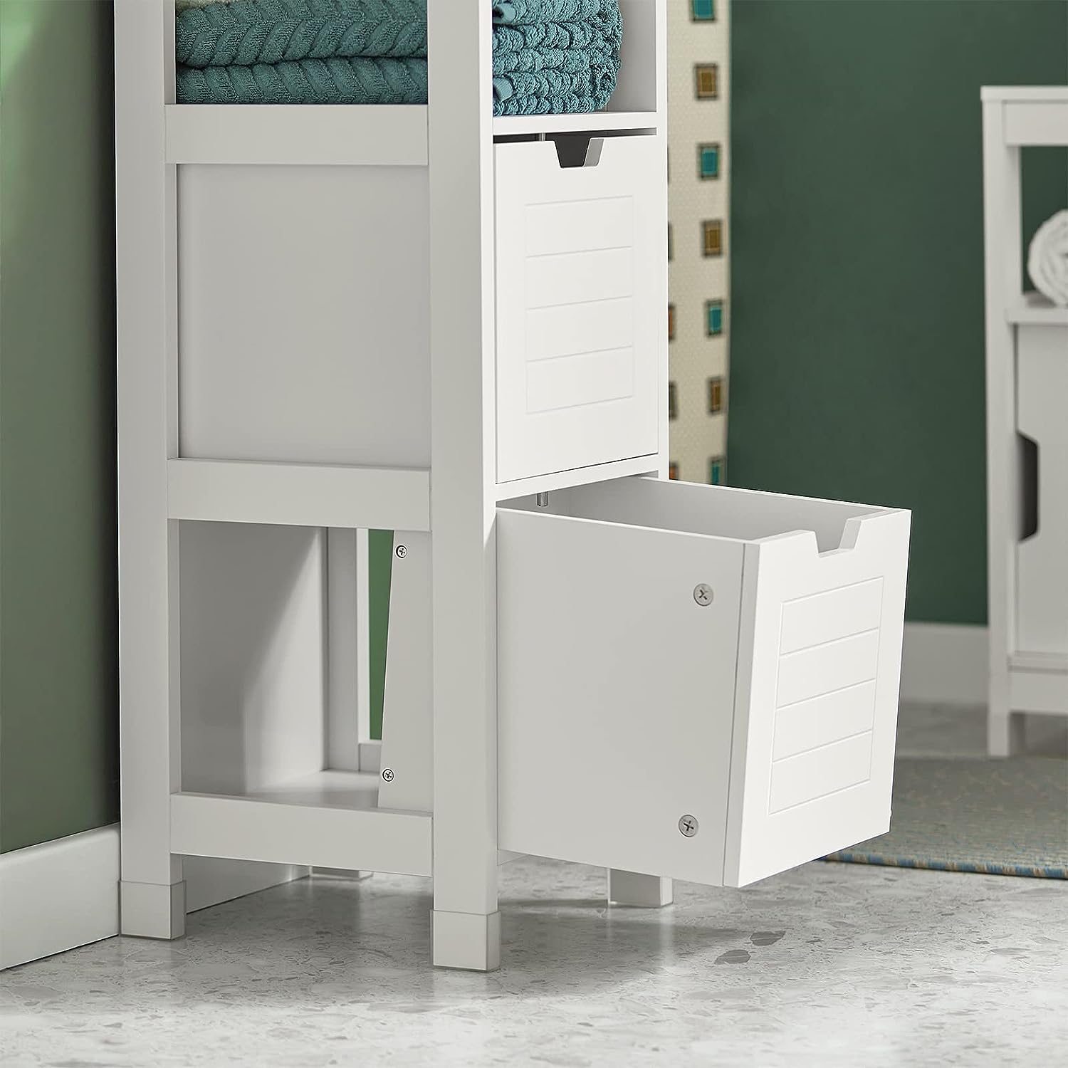 White freestanding cabinet with open shelves and two drawers, side angle view