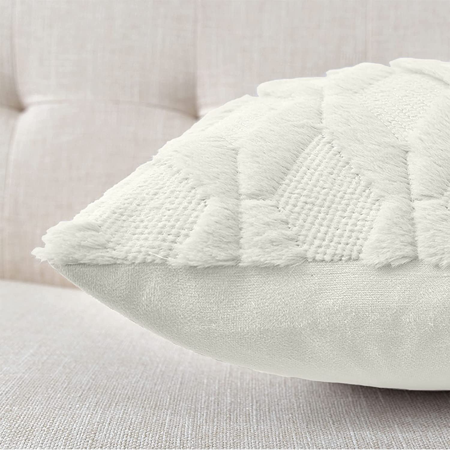 White pillow cover with raised diamond-texture pattern, angled view on cushion