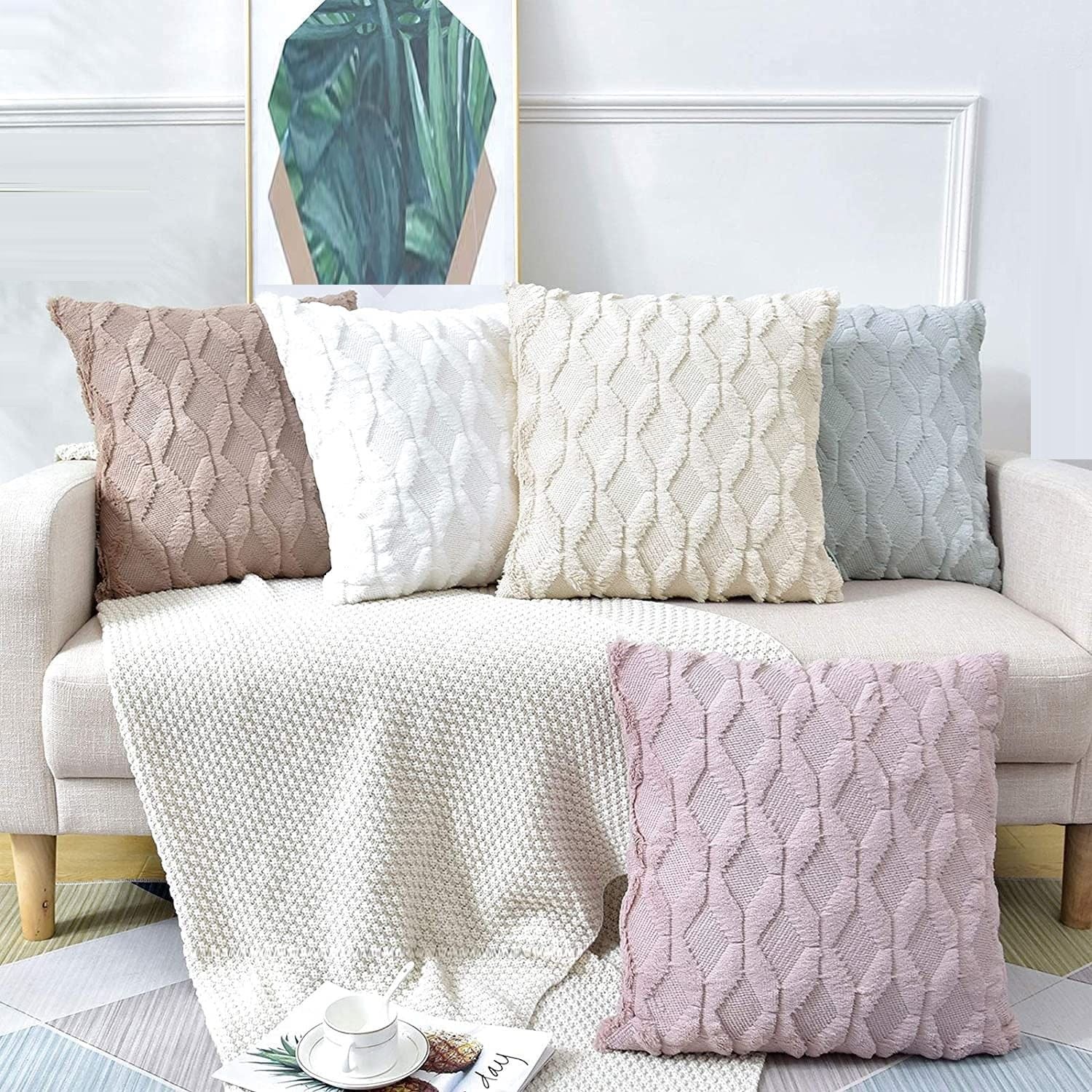 White quilted diamond throw pillow cover among coordinated colors on sofa