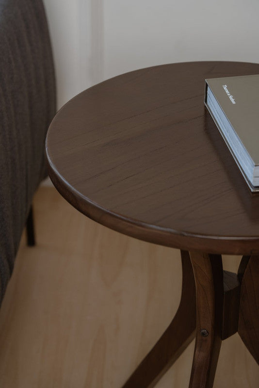 Walnut round side table with smooth curved tabletop edge