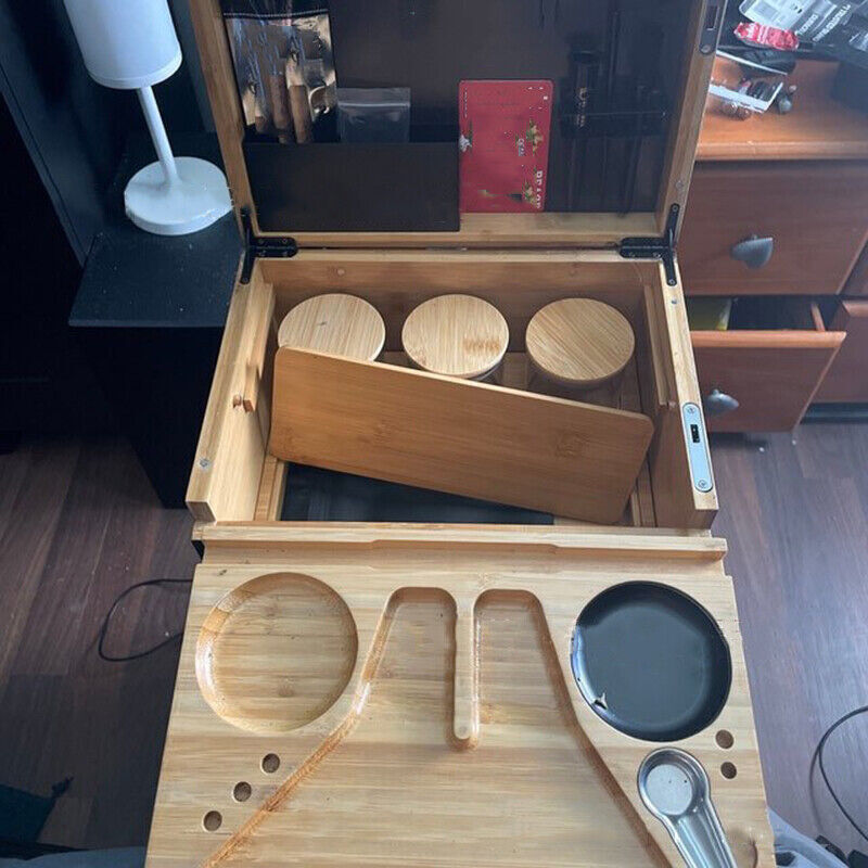 Open storage chest with wooden tray holding three round cup openings and accessory slots