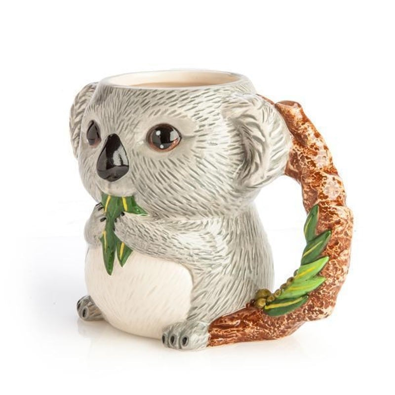 Ceramic koala mug with textured white fur, green leaves and brown accent detail