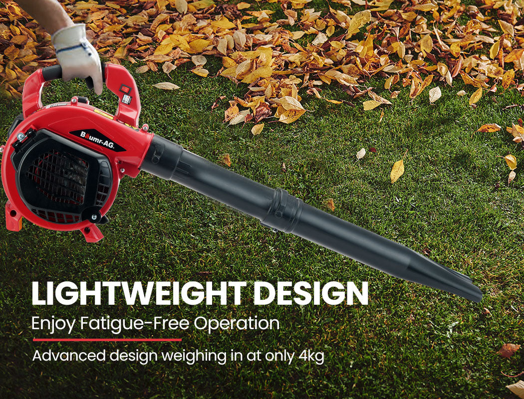 BAUMR-AG handheld blower vacuum running on grass with extended black tube