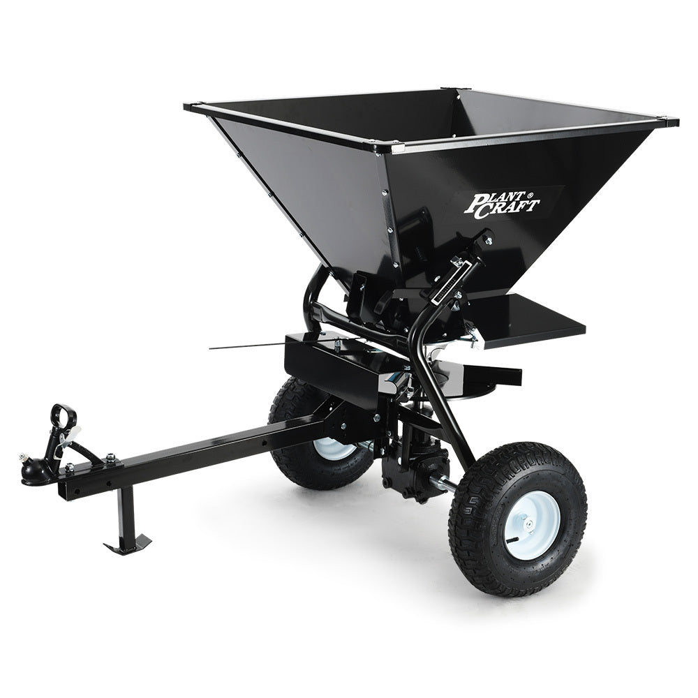 Tow-behind broadcast seed and fertiliser spreader with large black hopper and two wheels