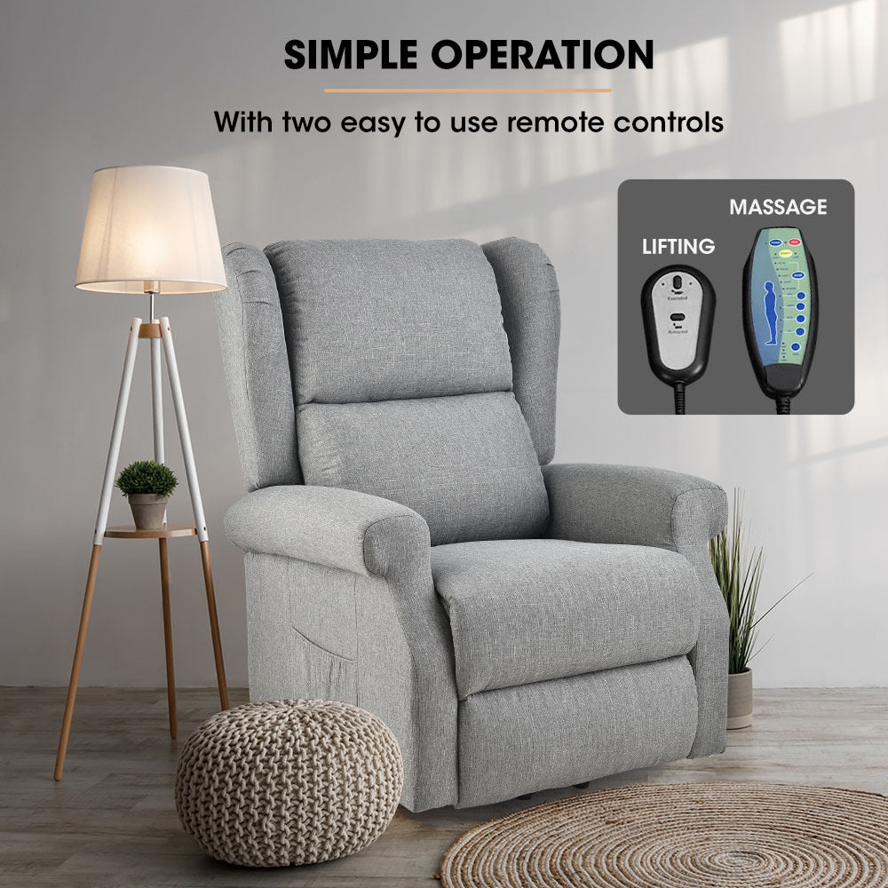 Grey recliner lift chair with remote controls, padded armrests, and tall backrest.