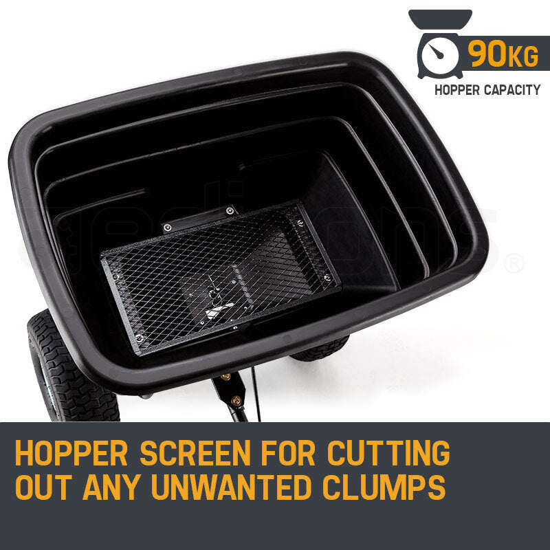 Black hopper tray with metal screen insert to help break up clumps during spreading