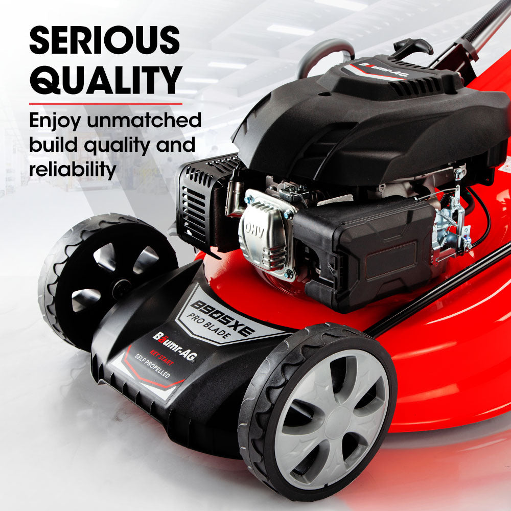 Red and black lawn mower with exposed engine and black deck housing