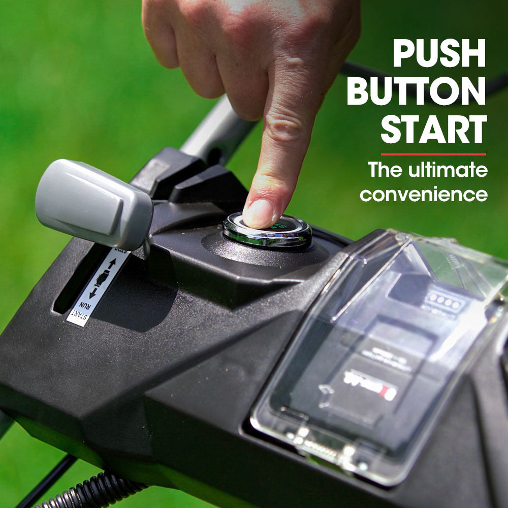 Black push-button start control on a lawn mower handle