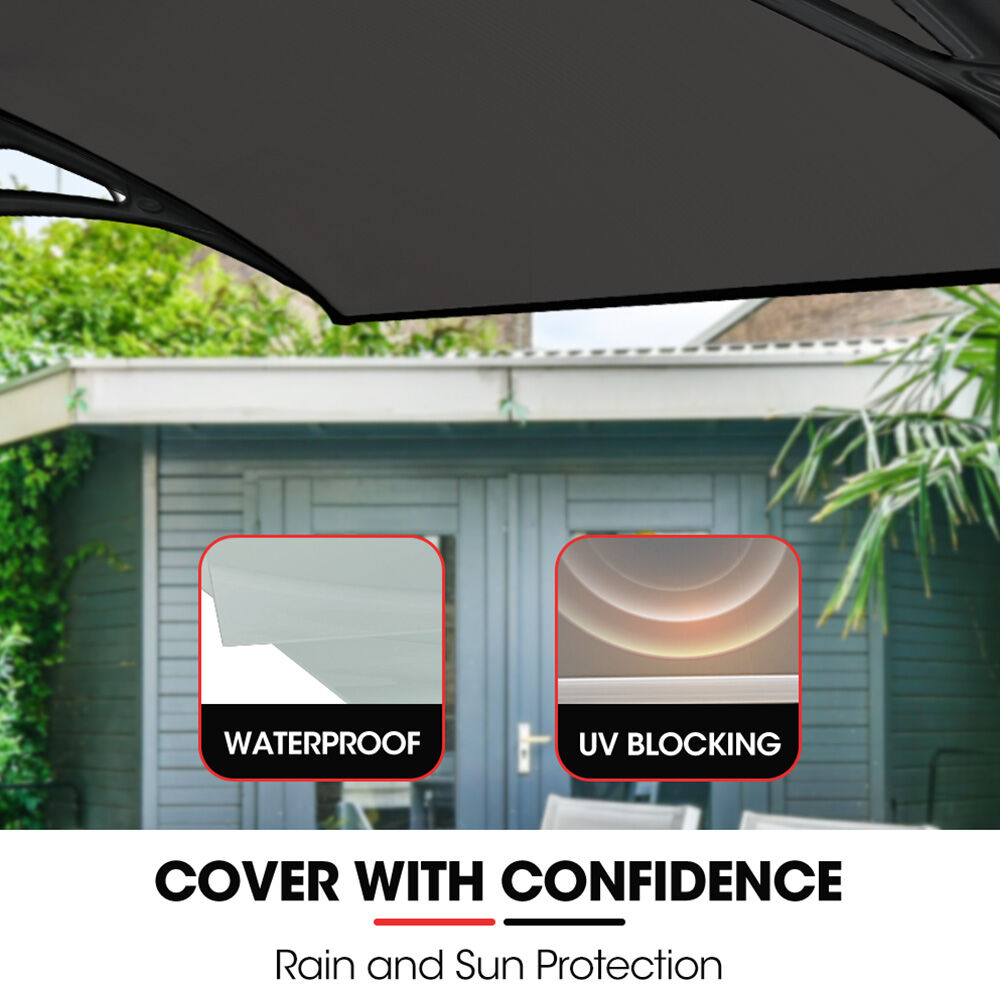 Installed exterior awning with grey tinted polycarbonate canopy and dark mounting frame