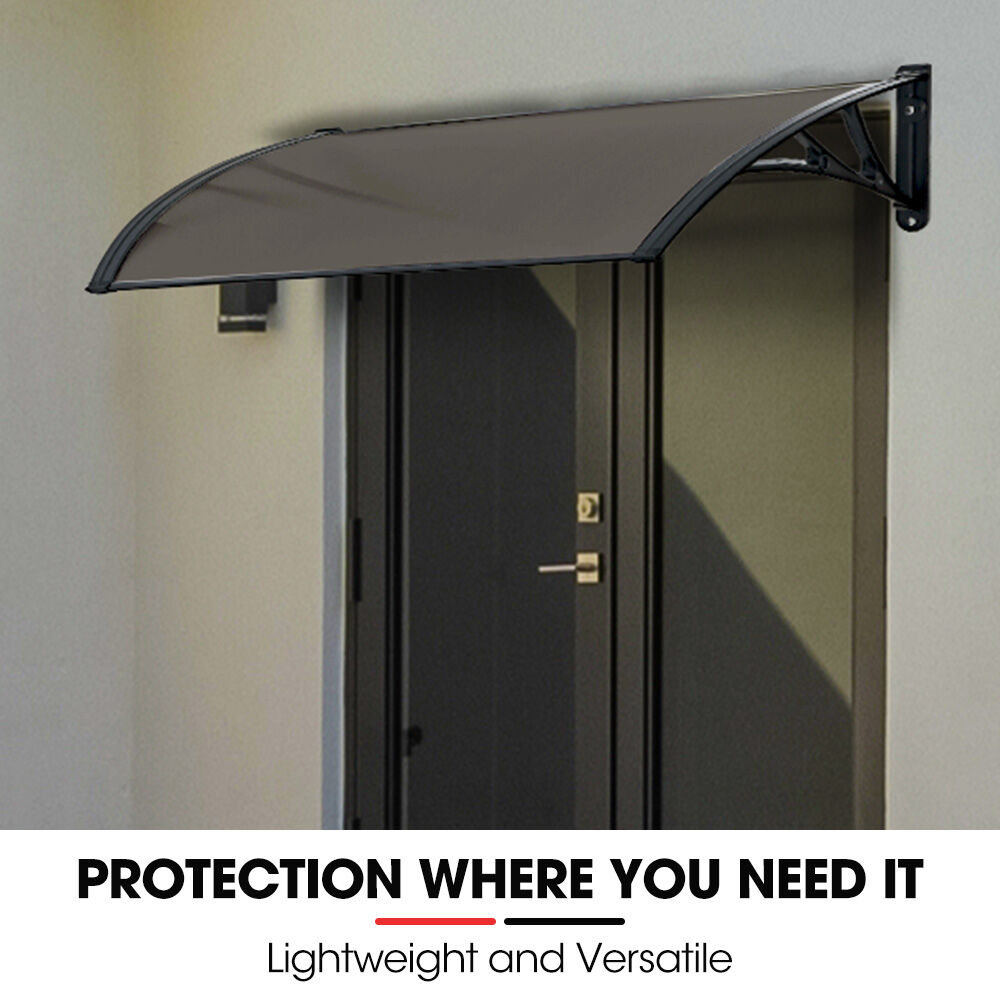 Exterior awning canopy with curved grey tinted polycarbonate roof and wall bracket arms