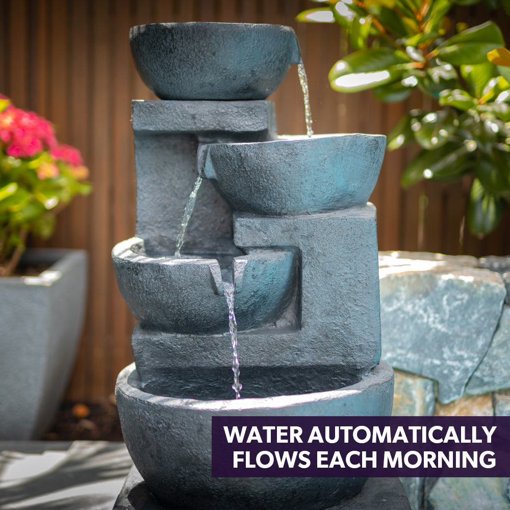 Charcoal four-bowl outdoor water fountain with flowing waterfall streams