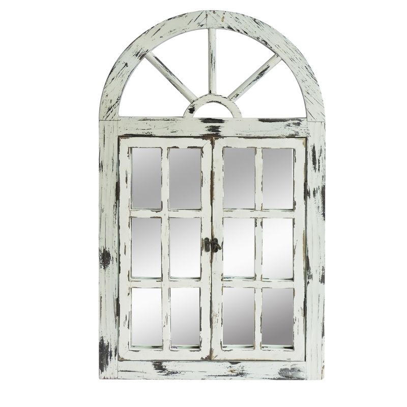 Front view arched window mirror with distressed white frame and four-by-four grid panes