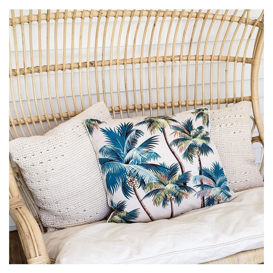 Palm tree cushion cover with piping, cream and teal-blue palms on a square cover