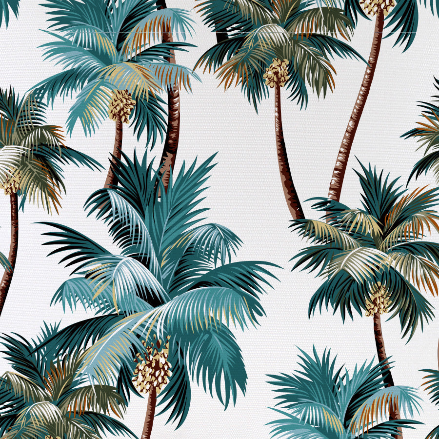 Close-up of white cushion cover fabric with teal, green, and brown palm print