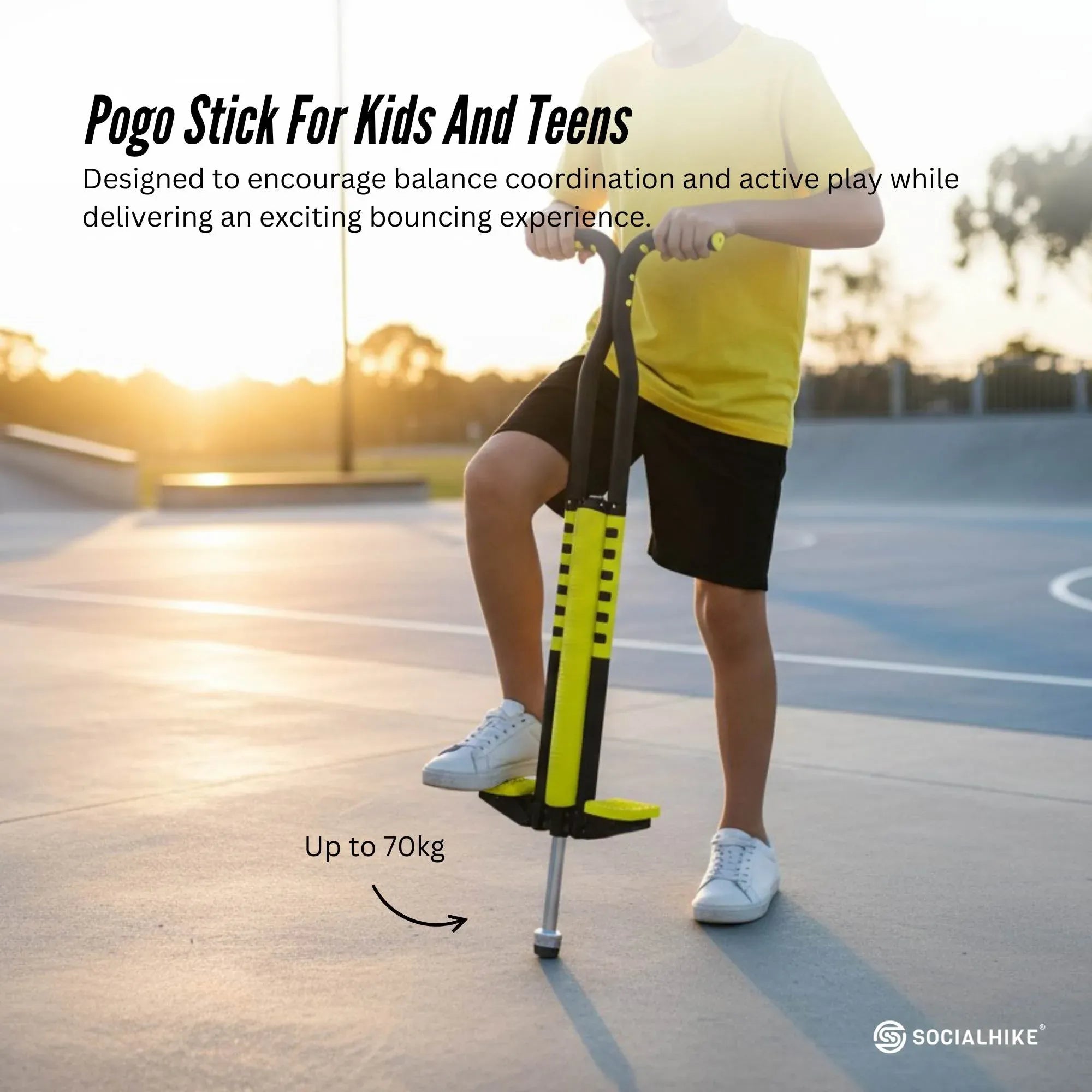 Yellow pogo stick for kids with padded foot platform and metal support pole