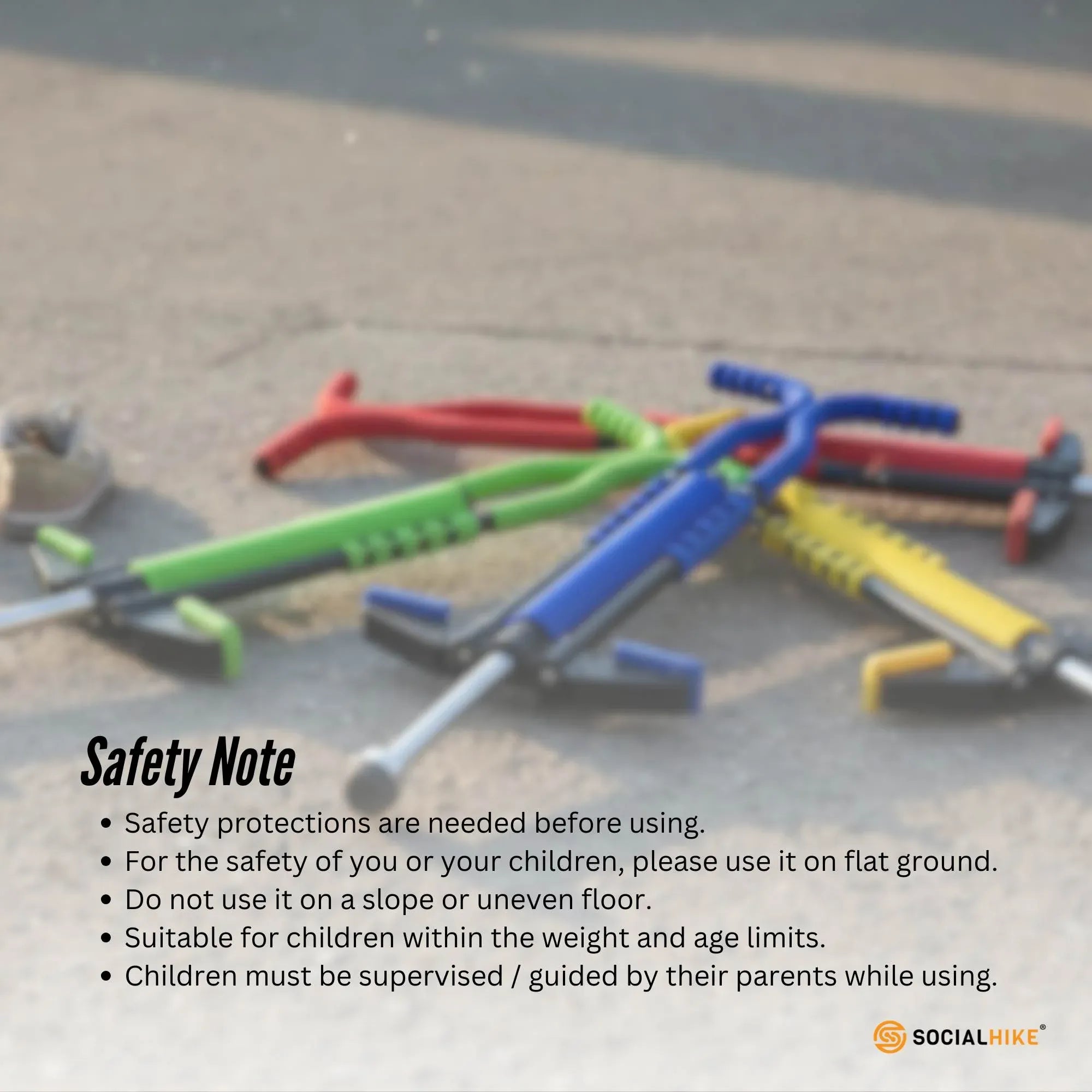 Assorted-color pogo sticks with spring poles and padded foot legs on the floor