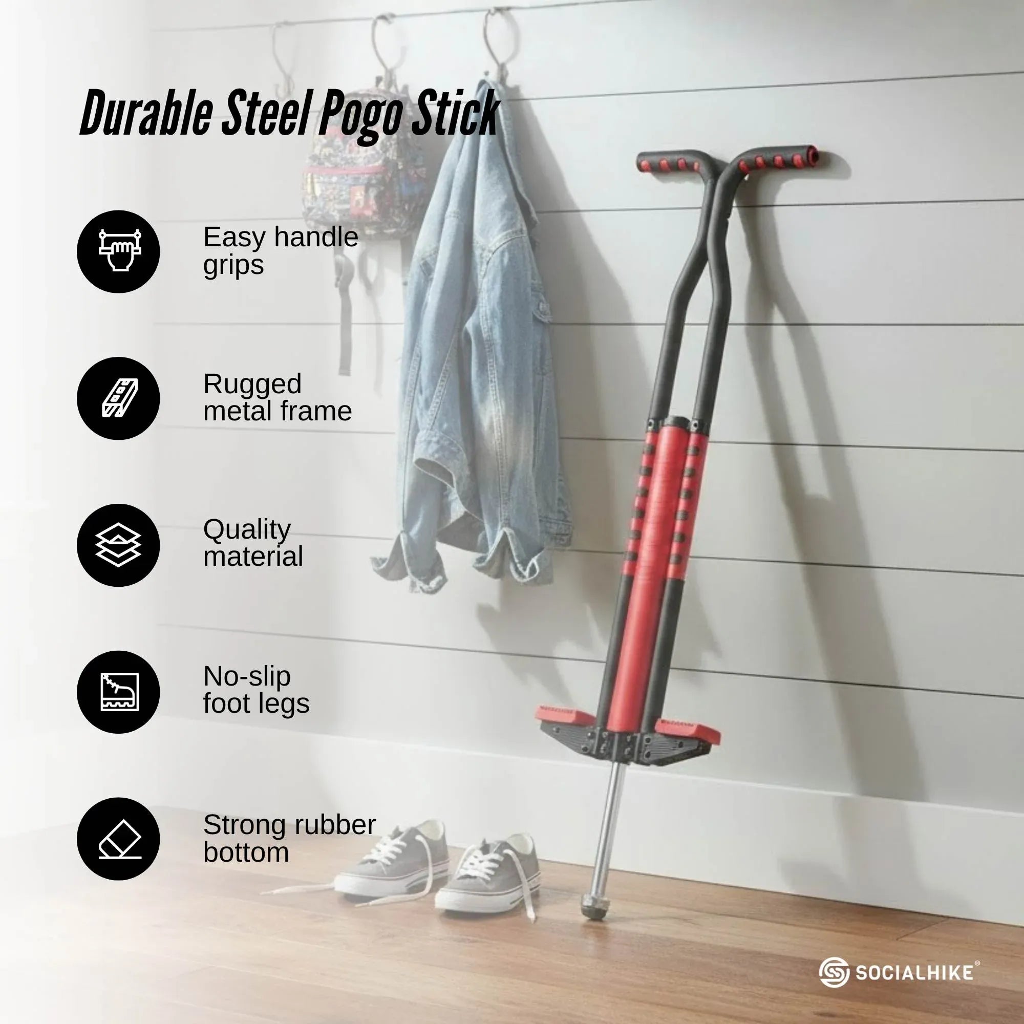 Red steel pogo stick with textured handle grips and no-slip foot legs