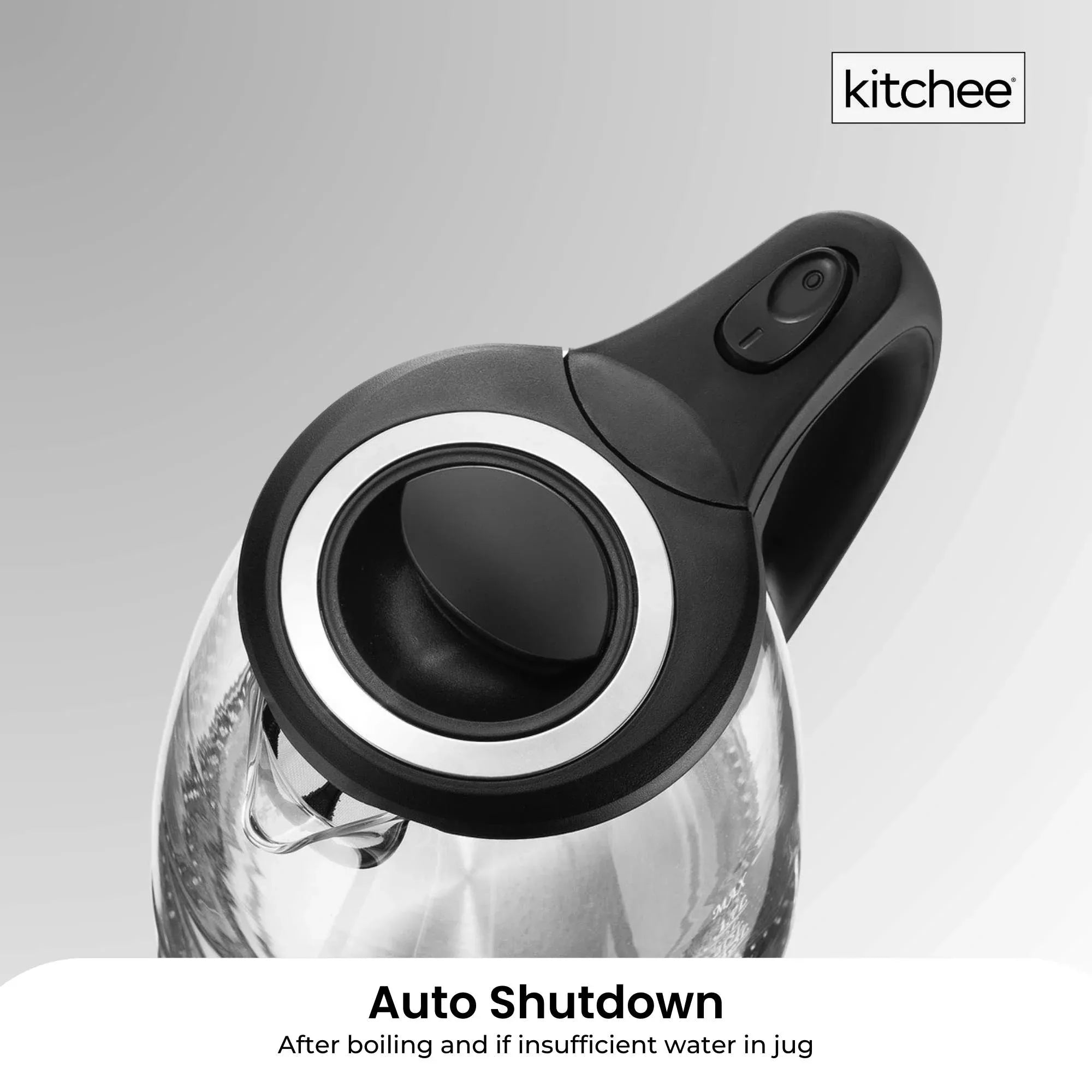 Glass electric kettle lid and pouring spout with black accents, close-up