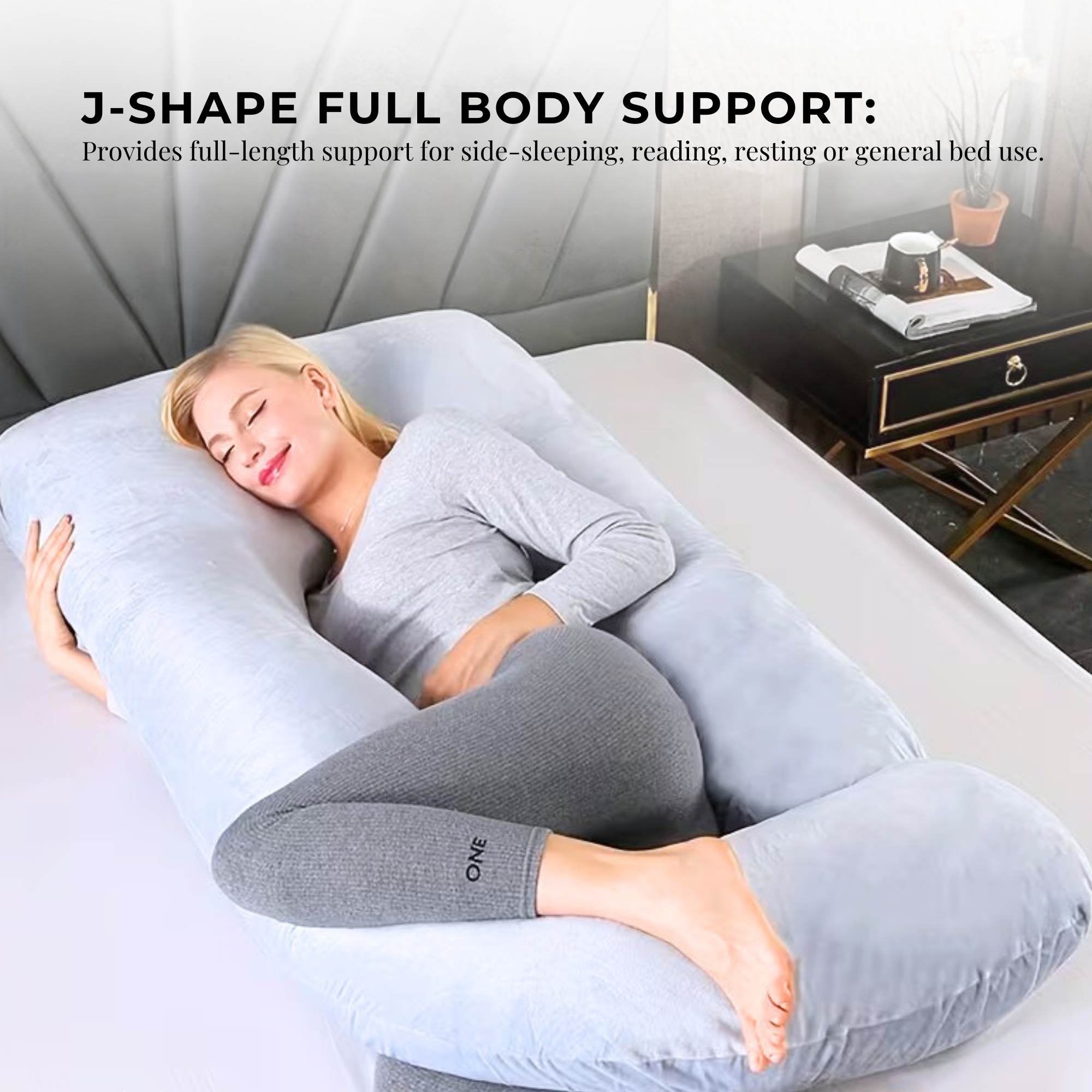 J-shaped maternity pregnancy pillow in light gray providing full body support for side sleeping