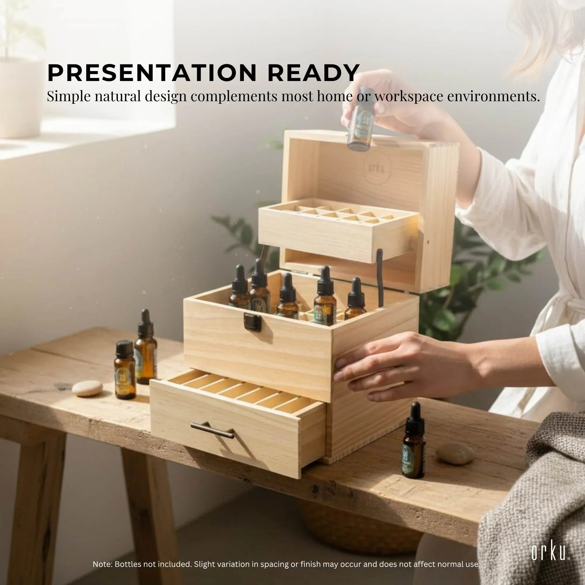 Wooden three-tier essential oil storage box with stacked compartments, open