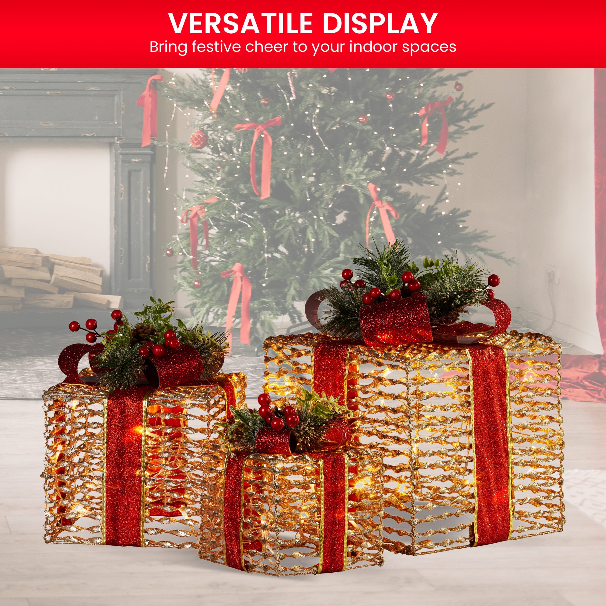 Three champagne gift boxes with red ribbon bows, pine greenery and warm LED lights