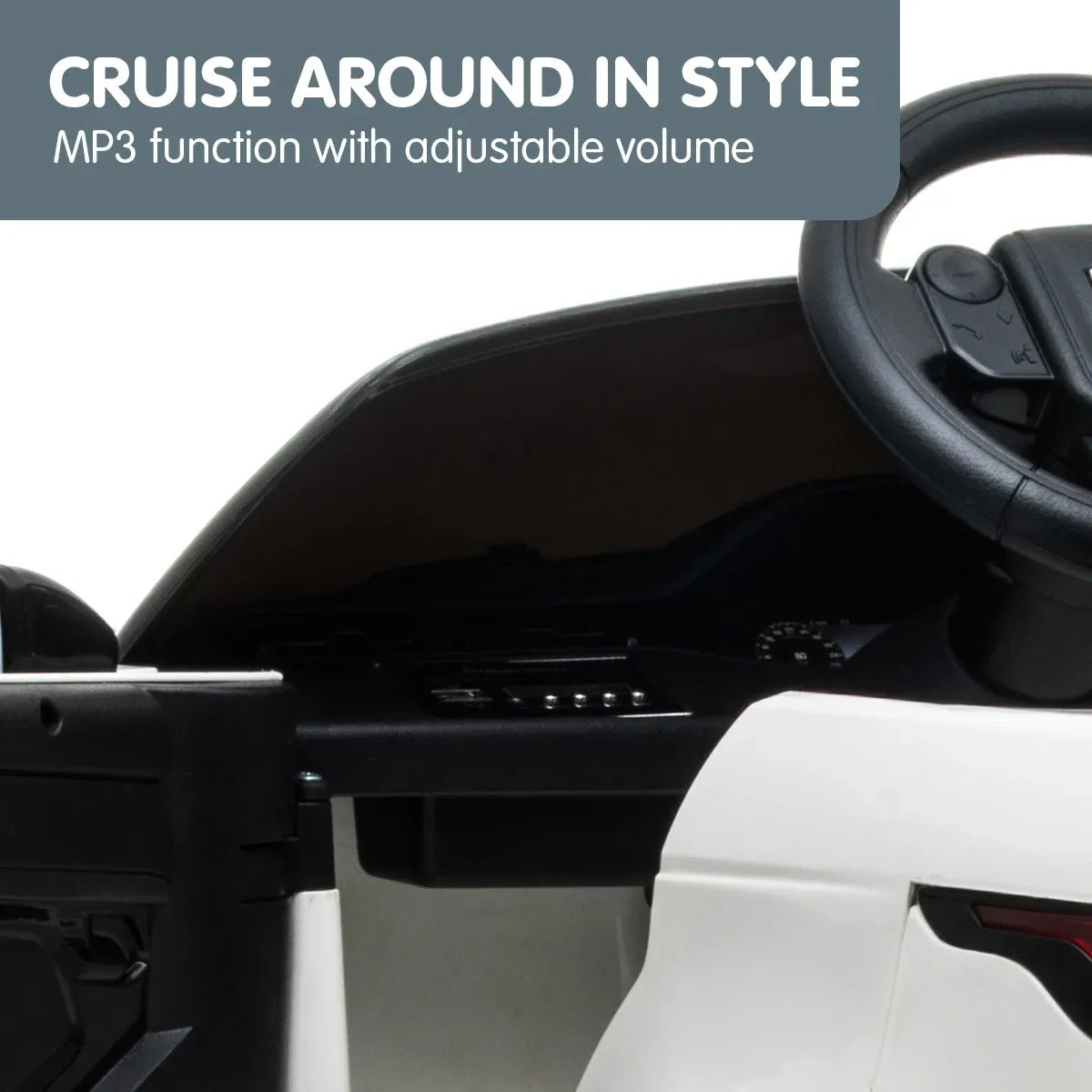 Interior of white kids electric ride-on SUV with steering wheel and dashboard controls