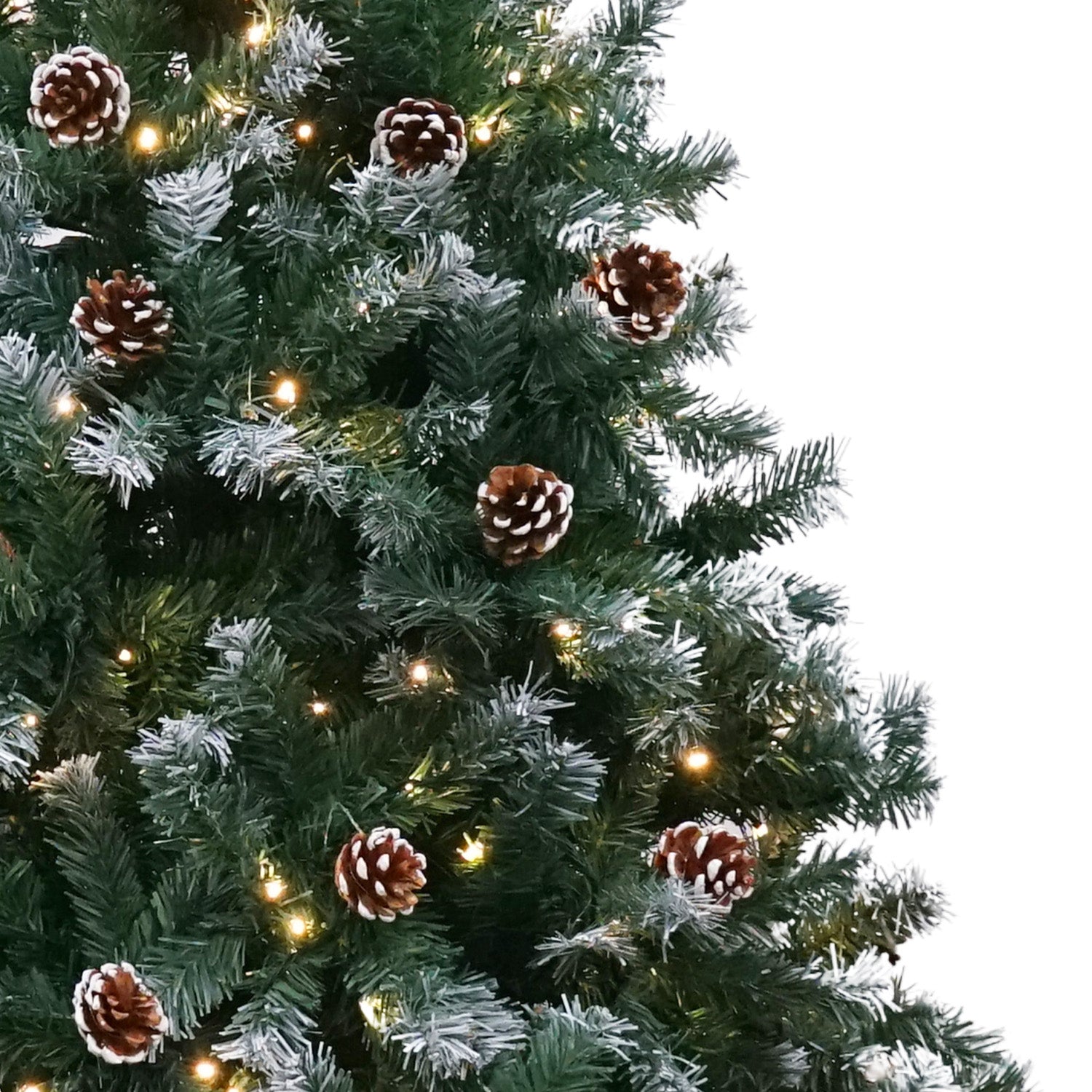 Close-up frosted Christmas tree with pine cones and warm white LED lights