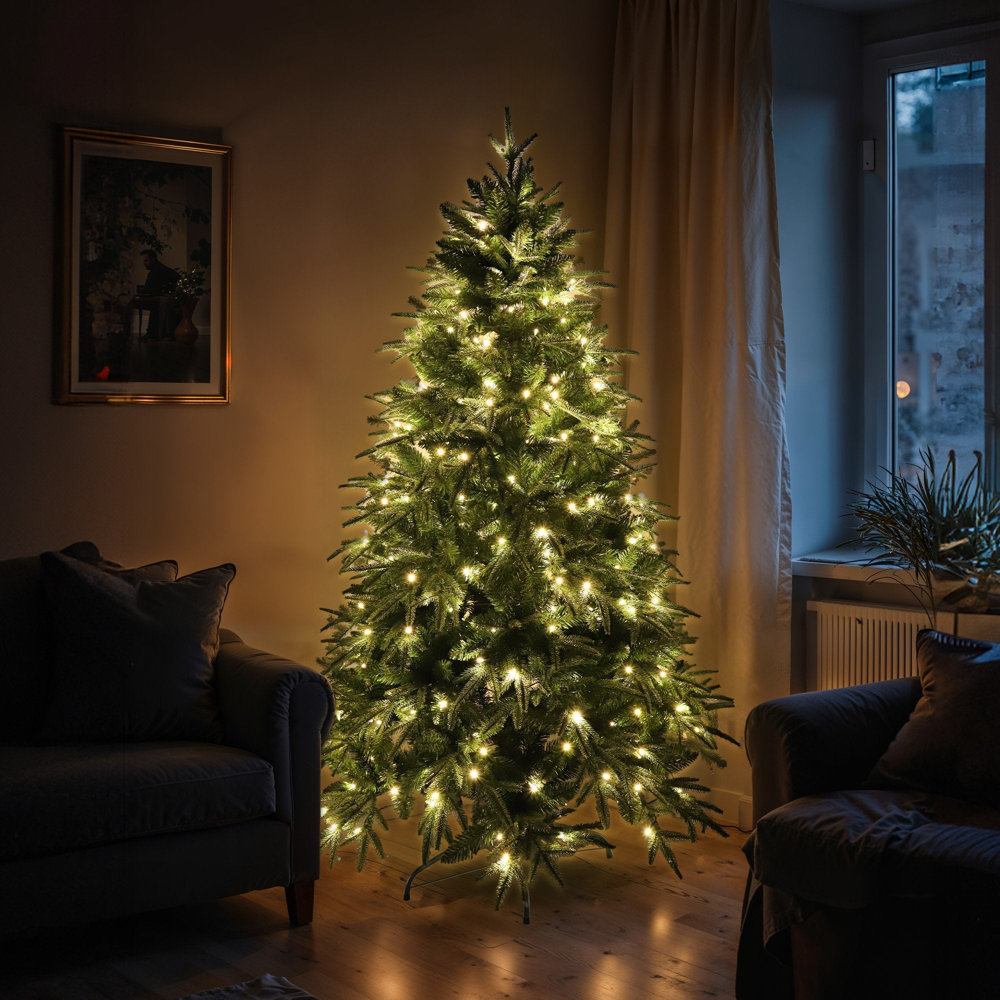 Prelit artificial fir Christmas tree with warm white LED lights and full branches