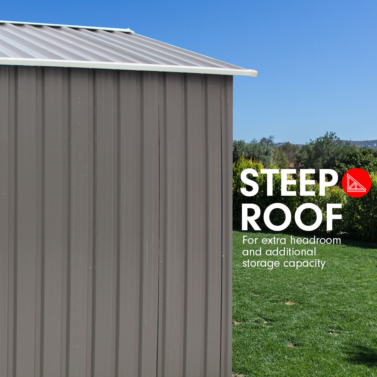 Grey outdoor storage shed with steep roof and corrugated wall panels