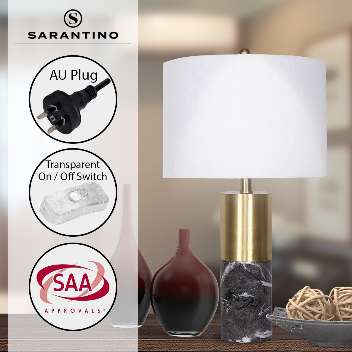 Table lamp with white shade, brass body, black marble base and on/off switch icons