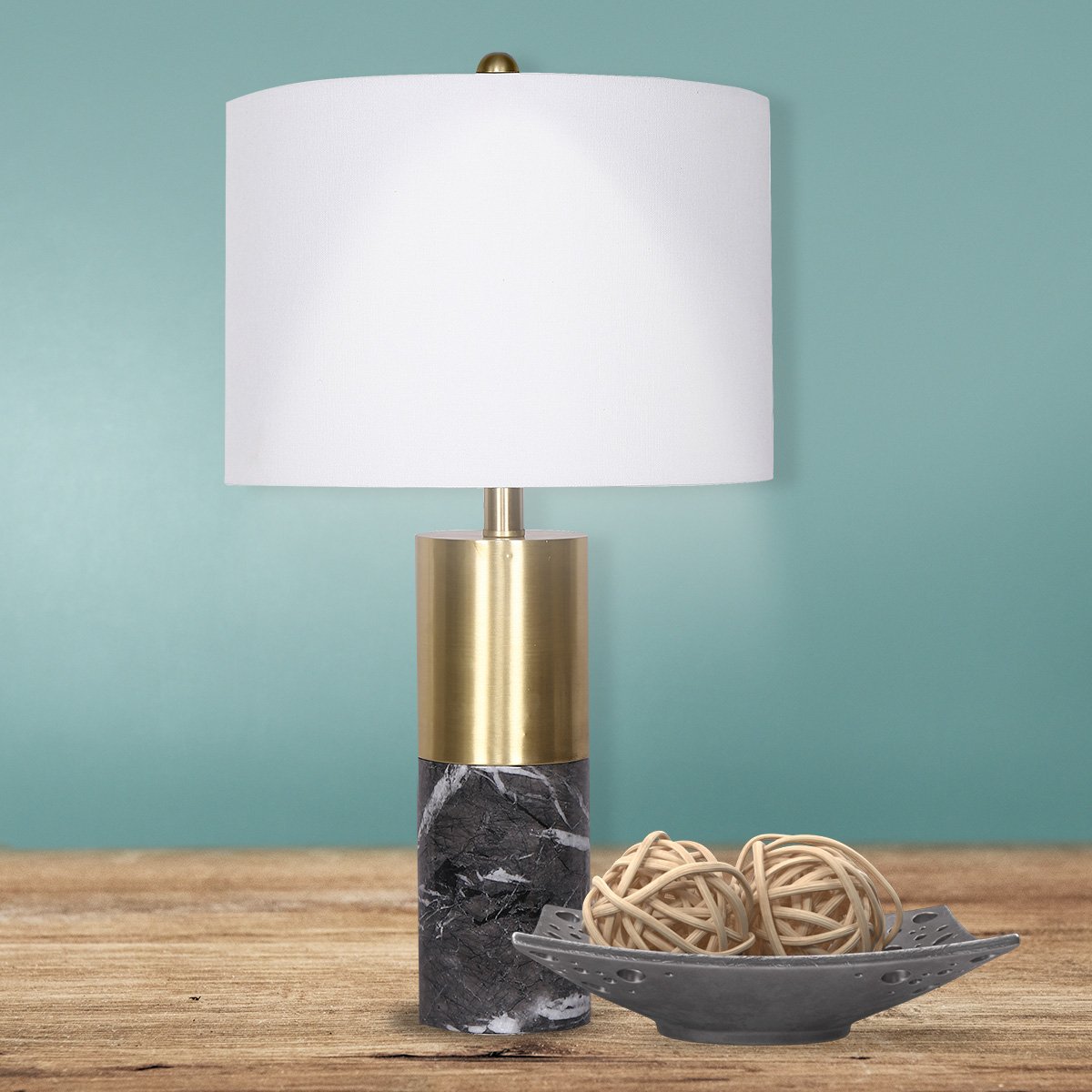 Table lamp with white shade, brass column, black marble base and coiled transparent cord