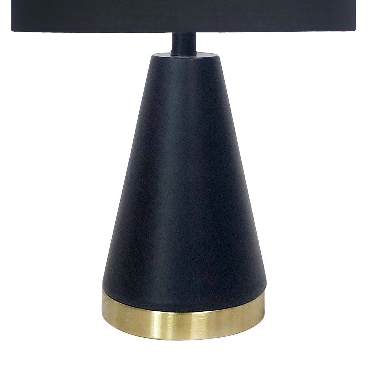 Black tapered metal lamp base with gold bottom ring under drum shade.