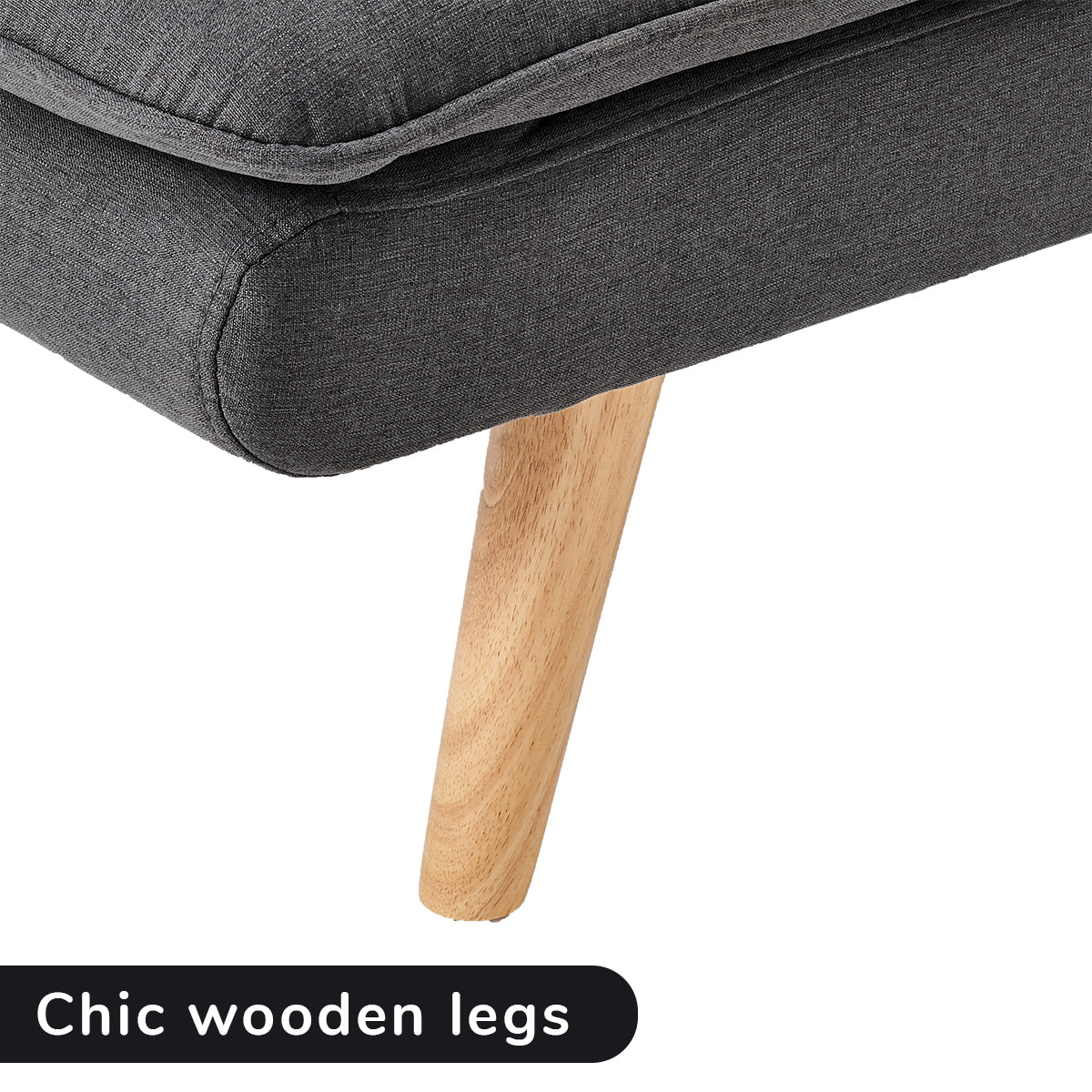 Dark grey sofa bed corner with rounded armrest and light wood tapered legs