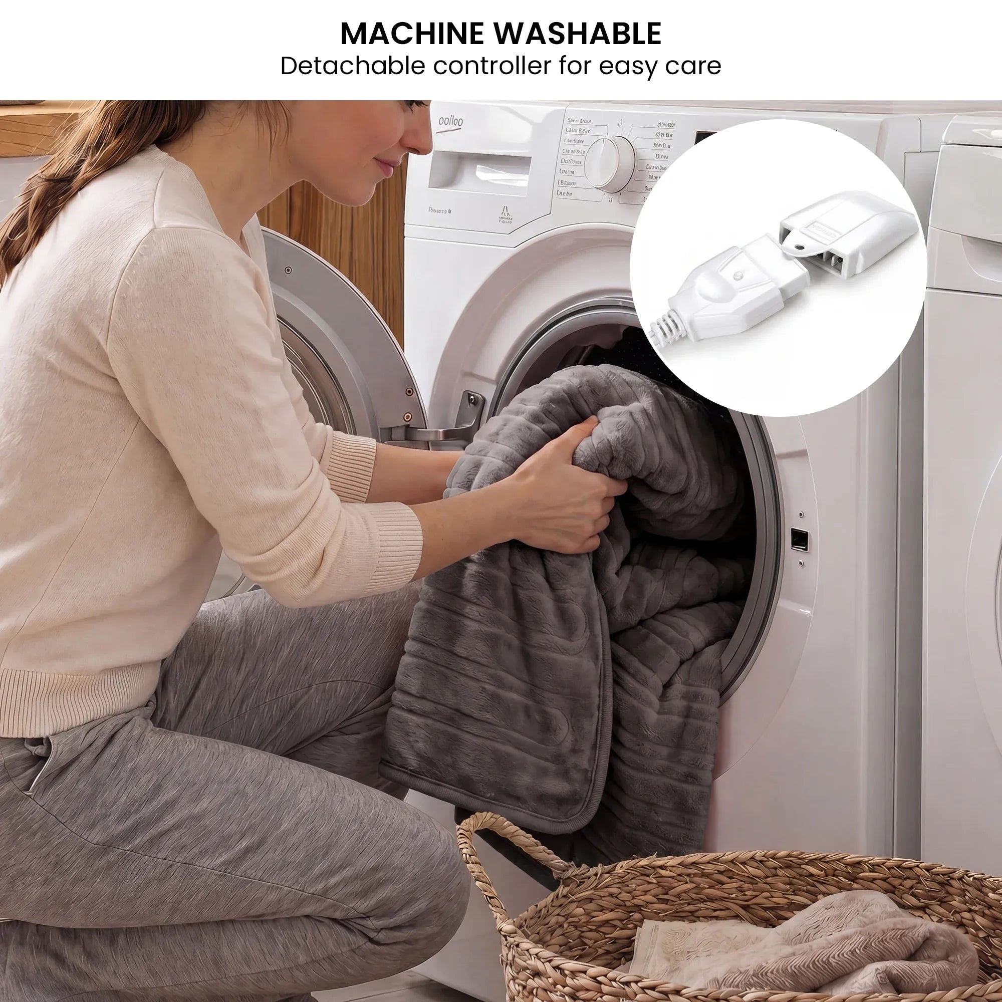 Grey heated throw blanket being washed, with detachable controller shown nearby.