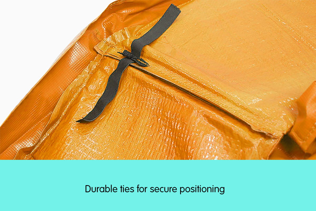Orange trampoline pad edge with black tie straps and fastening tab